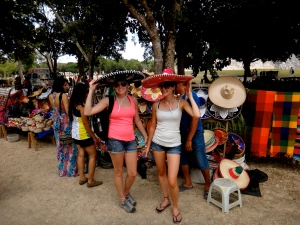 Jackie and Me trying on sombreros at Chichen Itza